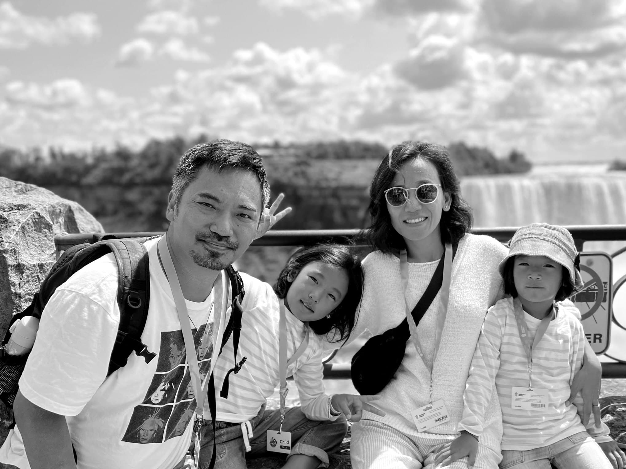 Our founder and his wife with their two children, by the falls