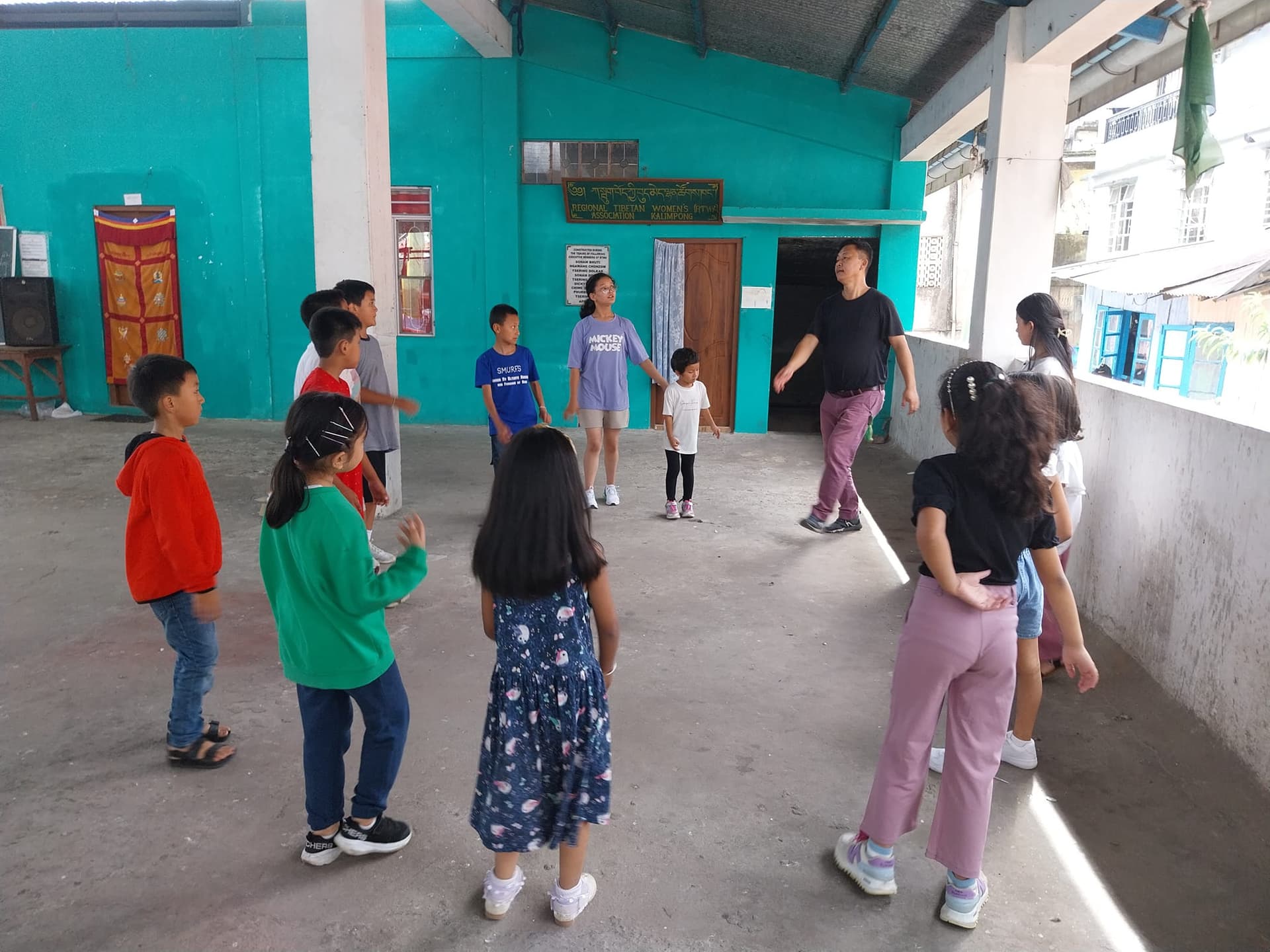Children learning traditional Tibetan dance at a Gangjong Doeghar training session