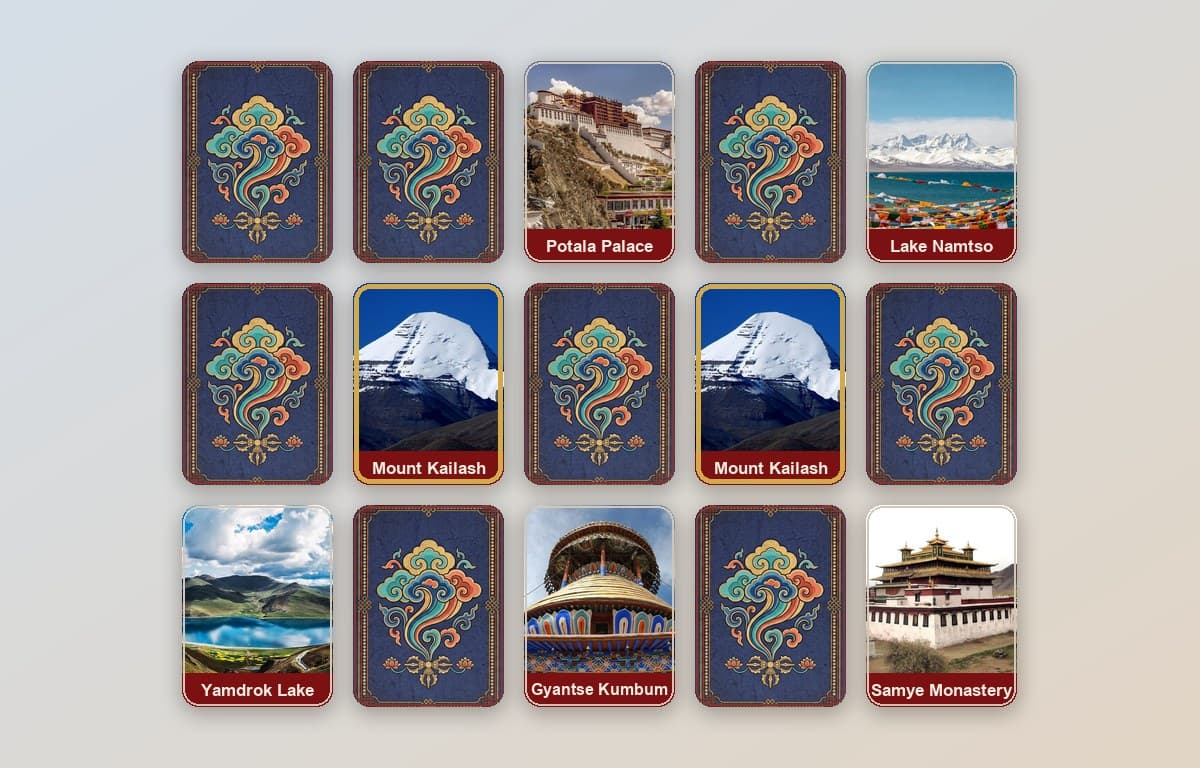 A Memory Match board — face-down cards with a Tibetan design, and revealed landmark cards including a matched pair of Mount Kailash